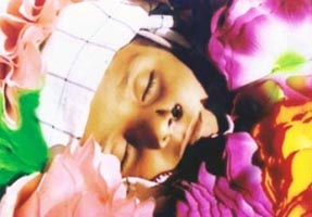 An eight year old boy killed by a drone strike in Makeen, South Waziristan. He is covered in flowers for his funeral.